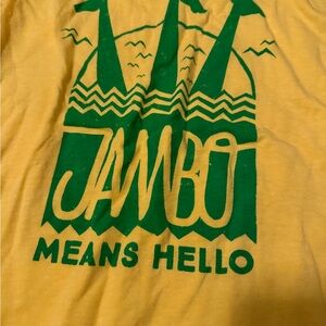 Yellow T-Shirt with Green "Jambo Means Hello" Graphic